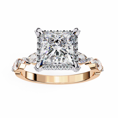Rose gold ring with a large diamond and smaller diamonds on the sides against a white background