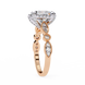 Rose gold ring with diamond accents on a white background