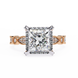 Diamond ring with rose gold accents on a white background