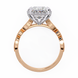 Rose gold ring with a diamond on a white background