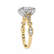 Gold ring with diamond accents on a white background