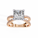 Rose gold ring with a large diamond and smaller diamonds on the band against a white background