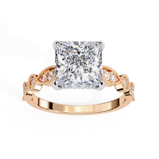 Rose gold ring with a large diamond and smaller diamonds on the band against a white background
