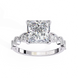 Diamond ring with a prominent princess-cut diamond on a white background