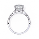 White gold ring with a large diamond and smaller diamonds on the band against a white background