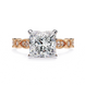 Rose gold ring with a large diamond and smaller diamonds on the band against a white background