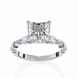 Diamond ring with a prominent central diamond and smaller diamonds on the sides against a white background