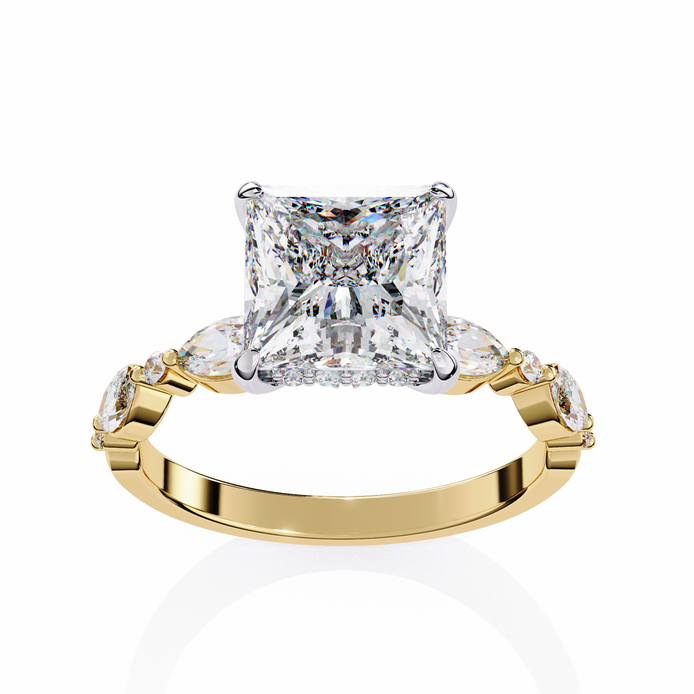 Gold ring with a large diamond and smaller diamonds on the sides against a white background