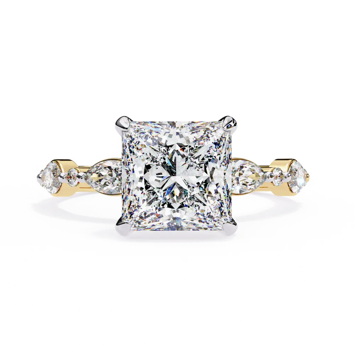 Diamond ring with a yellow gold band on a white background