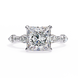 Diamond ring with a square-cut center stone on a white background