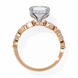 Rose gold ring with diamond accents on a white background