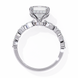 Silver ring with diamond accents on a white background