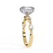 Gold ring with a large diamond and smaller stones on a white background