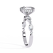 Diamond ring with a central large diamond and smaller diamonds on a white background
