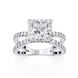 Diamond ring with a prominent central gemstone on a white background