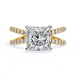 Gold ring with a large diamond and smaller diamonds on the band against a white background