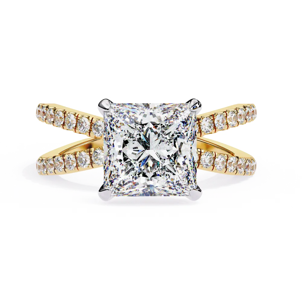 Gold ring with a large diamond and smaller diamonds on the band against a white background