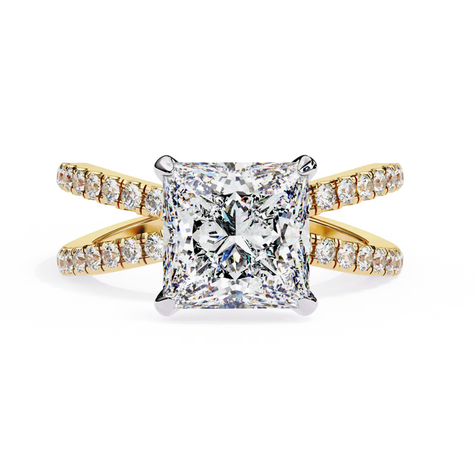 Gold ring with a large diamond and smaller diamonds on the band against a white background