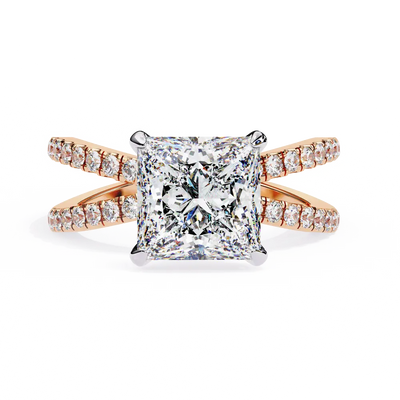 Rose gold ring with a large diamond and smaller diamonds on the band against a white background