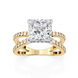 Gold ring with a large diamond and smaller diamonds on the band against a white background
