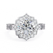 Diamond ring with a floral halo on a white background