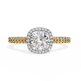 Diamond ring with yellow and white gold band on a white background