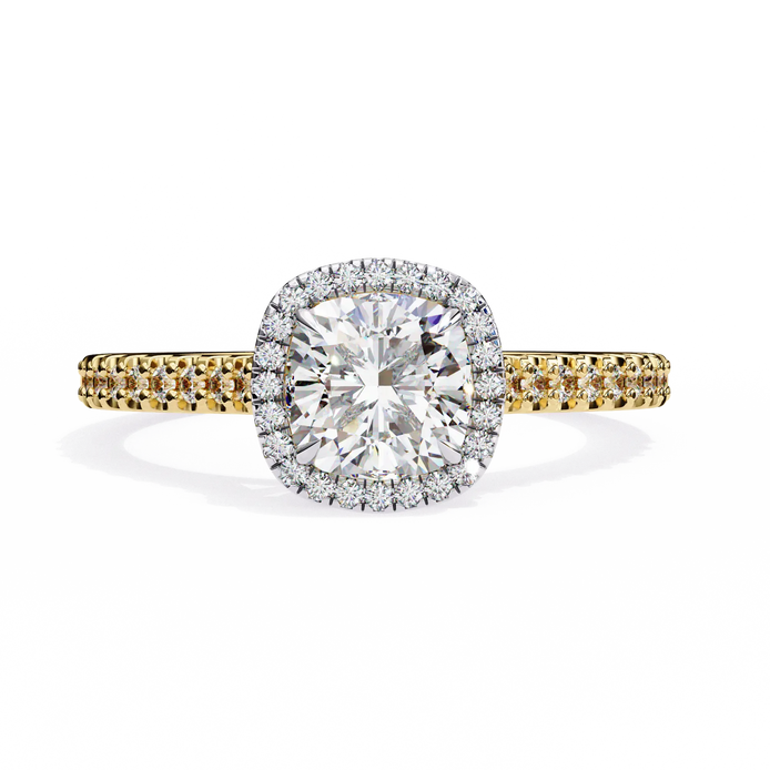 Diamond ring with yellow and white gold band on a white background