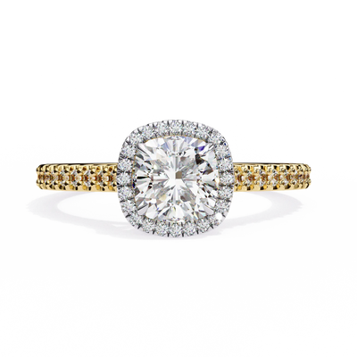 Diamond ring with yellow and white gold band on a white background