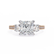 Diamond ring with a central diamond and two smaller diamonds on a white background