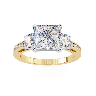Gold ring with a central square-cut diamond and two smaller diamonds on a white background