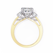 Two-tone gold and silver ring with a diamond on a white background