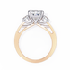 Two-tone gold ring with a diamond on a white background