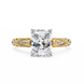 Gold ring with a large diamond on a white background