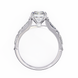 Diamond ring with a heart-shaped center stone on a white background