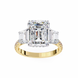 Gold ring with a large diamond and smaller emerald-cut diamonds on a white background
