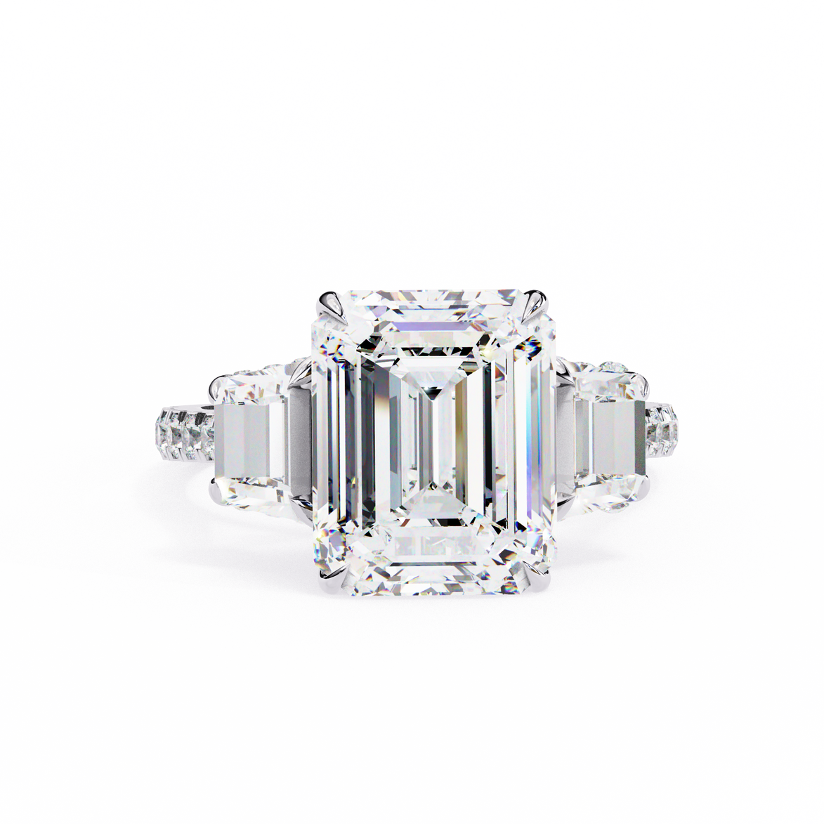 Diamond ring with emerald-cut center stone on a white background