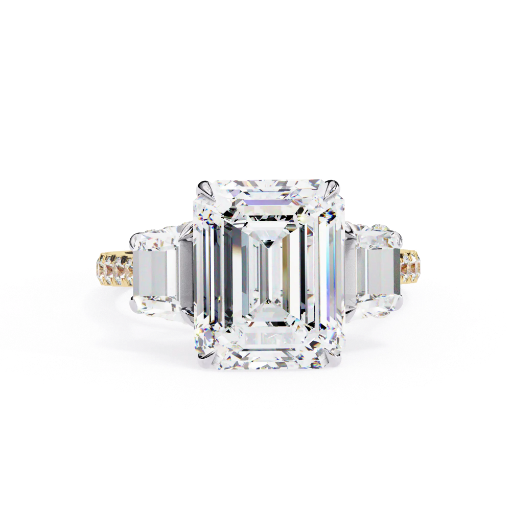 Diamond ring with emerald-cut center stone on a white background