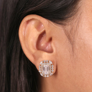 Yellow gold emerald cut lab grown diamond halo stud earrings with prong-set centers, round halos and marquise accents.