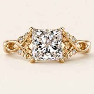 Princess cut lab grown diamond engagement ring with 2 ct center, intertwined leaf-and-vine shoulders, round diamond accents and four-prong yellow gold basket.