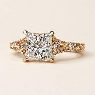 Princess cut lab grown diamond engagement ring with four corner claws, filigree cathedral shoulders, milgrain edging and round diamond accents in yellow gold.