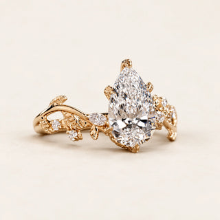Pear Cut Lab Grown Diamond Side Stone Engagement Ring in Yellow Gold