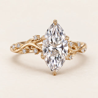 Marquise lab grown diamond Six-Prong engagement ring with vine shoulders and hidden blue gemstone in yellow gold