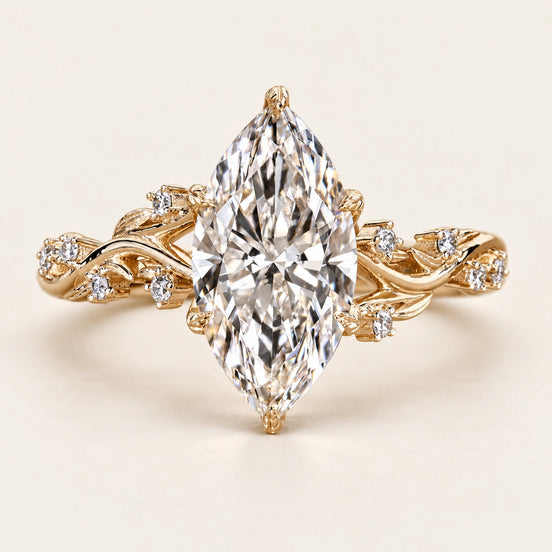 Marquise lab grown diamond Six-Prong engagement ring with vine shoulders and hidden blue gemstone in yellow gold