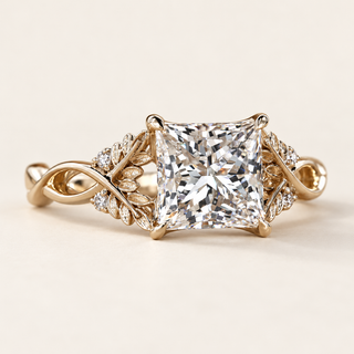 Princess cut lab grown diamond engagement ring with 2 ct center, intertwined leaf-and-vine shoulders, round diamond accents and four-prong yellow gold basket.