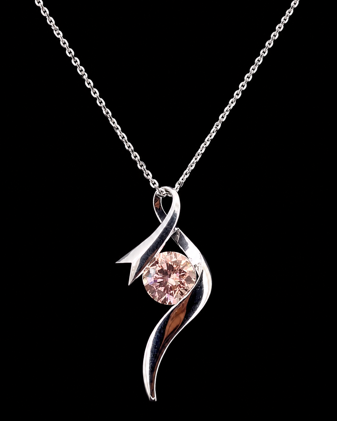 Main: White gold 1.75ct round sculptural pendant with lab grown diamond on black
Detail: Close-up of 1.75ct round lab grown diamond framed by a flowing white gold swirl
Side: White gold round diamond pendant showing the open asymmetrical ribbon profile