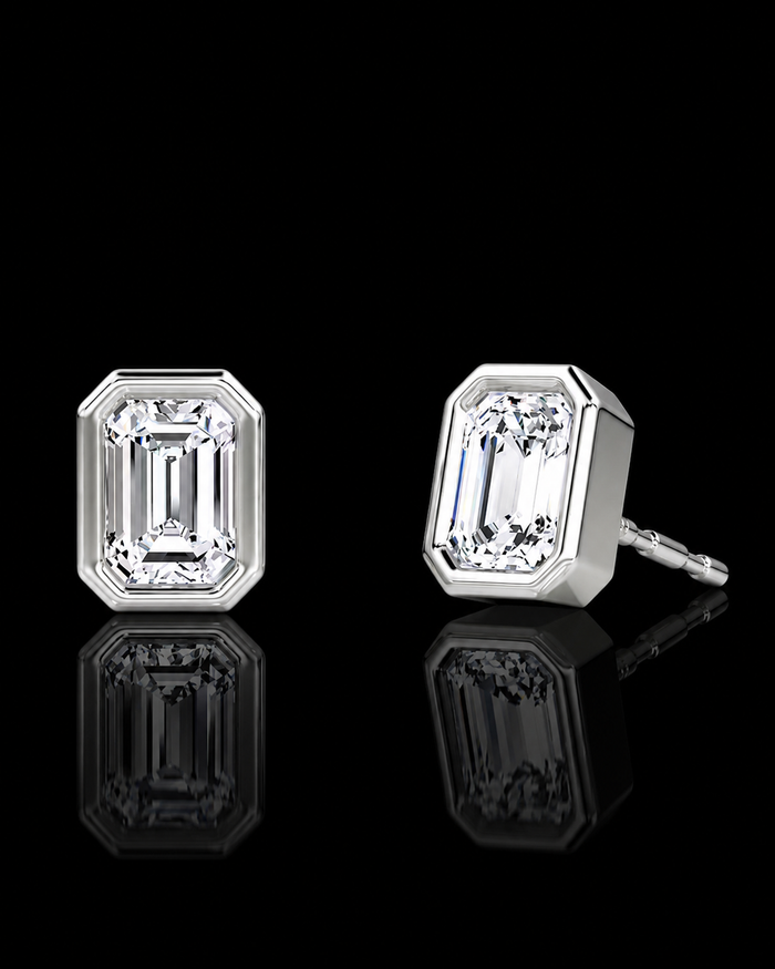 White gold emerald-cut stud earrings with 0.50ct total lab grown diamonds on black