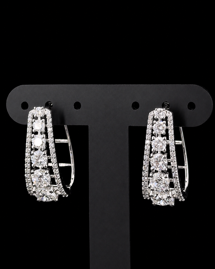White gold graduated hoop earrings with 3.206ct round lab grown diamonds on black