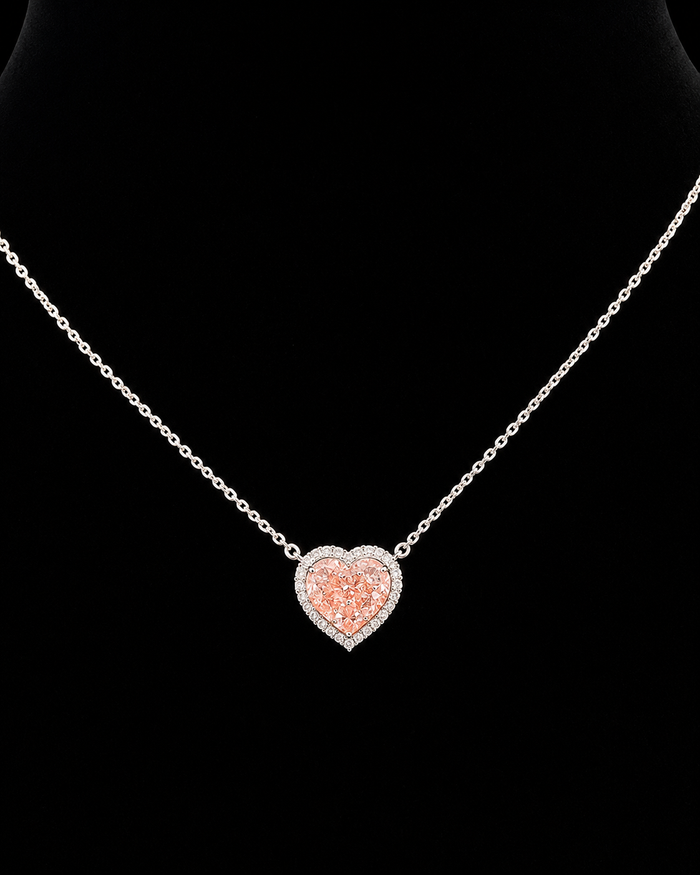 White gold 2.51ct pink heart halo pendant with round lab grown diamonds on black
