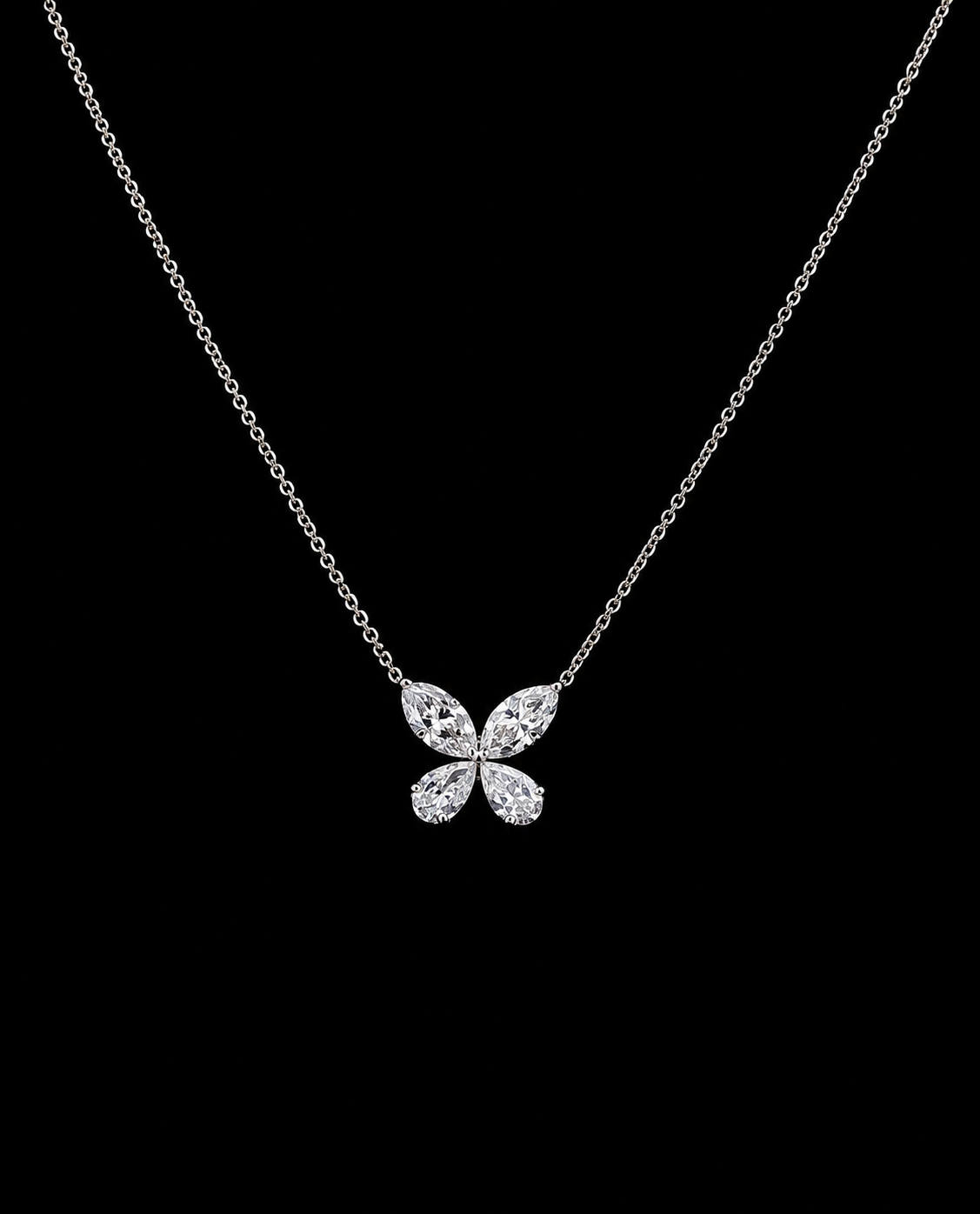 White gold butterfly pendant with marquise and pear lab grown diamonds on black