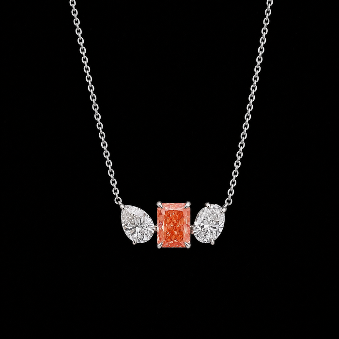 White gold pink radiant pendant with pear and oval lab grown diamond side stones
